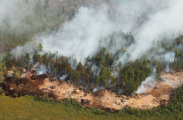 Crews clear trees and brush creating wide paths of bare soil called dozer guards at the Long Lake wildfire.