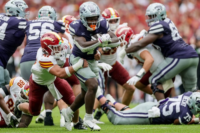 Aug 23, 2025; Dublin, IRELAND; Kansas State player Joe Jackson is tackled by Kooper Ebel of Iowa State during the Aer Lingus Classic between Iowa State and Kansas State at Aviva Stadium. Mandatory Credit: Laszlo Geczo/INPHO via Imagn Images