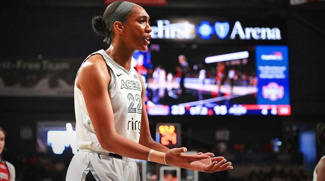 Aug 23, 2025; Washington, District of Columbia, USA; Las Vegas Aces center A'ja Wilson (22) argues a call against the Washington Mystics during the first quarter at CareFirst Arena. Mandatory Credit: Rafael Suanes-Imagn Images