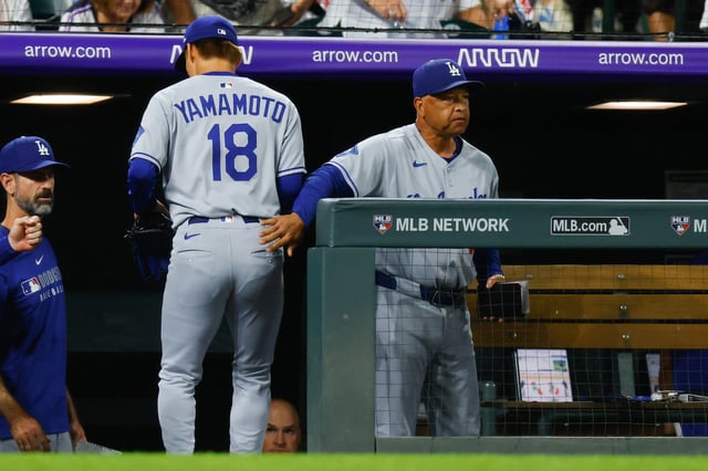 DENVER, CO - AUGUST 18: Manager Dave Roberts congratulates Yoshinobu Yamamoto #18 of the Los Angeles Dodgers as he walks off the field after the seventh inning against the Colorado Rockies at Coors Field on August 18, 2025 in Denver, Colorado.
