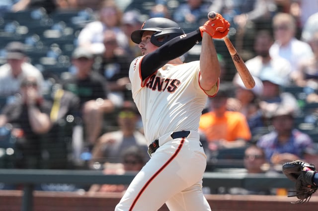 Aug 10, 2025; San Francisco, California, USA; San Francisco Giants third baseman Matt Chapman (26) hits a single against the Washington Nationals during the first inning at Oracle Park. Mandatory Credit: Darren Yamashita-Imagn Images/File photo