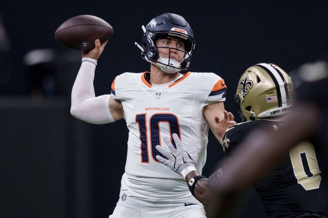 Aug 23, 2025; New Orleans, Louisiana, USA;  Denver Broncos quarterback Bo Nix (10) throws against New Orleans Saints safety Ugo Amadi (0) during the first half at Caesars Superdome. Mandatory Credit: Matthew Hinton-Imagn Images