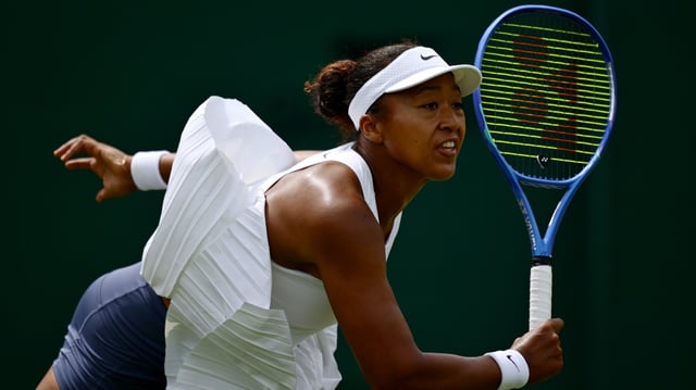 Naomi Osaka serves against Anastasia Pavlyuchenkova during a third round match on day five of Wimbledon at All England Lawn Tennis and Croquet Club on July 4, 2025 in London, England.