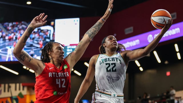 Aug 23, 2025; College Park, Georgia, USA; New York Liberty forward Kennedy Burke (22) attempts to shoot against Atlanta Dream center Brittney Griner (42) during the third quarter at Gateway Center Arena at College Park. Mandatory Credit: Jordan Godfree-Imagn Images