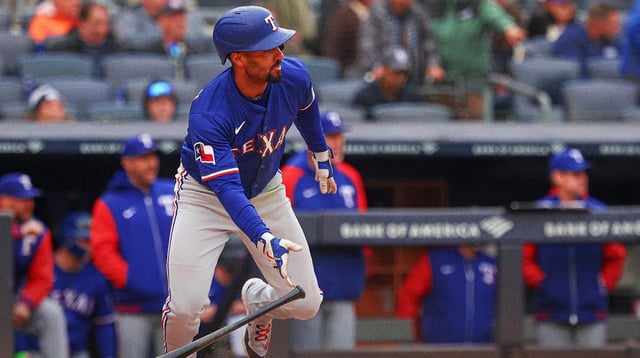 May 22, 2025; Bronx, New York, USA; Texas Rangers second baseman Marcus Semien (2) singles during the seventh inning against the New York Yankees at Yankee Stadium. Mandatory Credit: Vincent Carchietta-Imagn Images