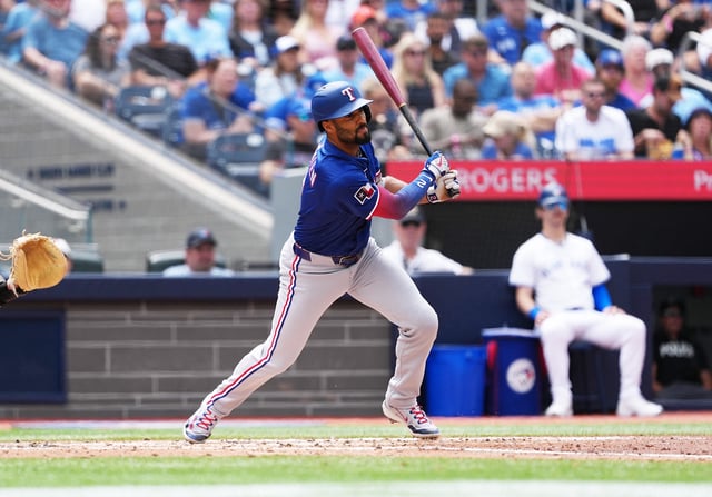 Aug 17, 2025; Toronto, Ontario, CAN; Texas Rangers second baseman Marcus Semien (2) hits a double against the Toronto Blue Jays during the fourth inning at Rogers Centre. Mandatory Credit: Nick Turchiaro-Imagn Images/File photo