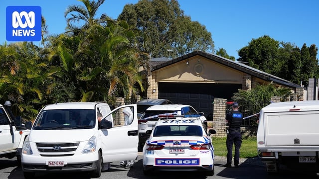 An array of police cars parked outside a house with police tape 