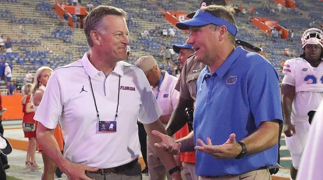 Florida Gators head coach Dan Mullen talks with athletic director Scott Stricklin after the win against the Florida Atlantic Owls at Ben Hill Griffin Stadium in Gainesville Fla. Sept. 4, 2021. The Gators beat the Owls 35-14. [Brad McClenny/The Gainesville Sun]