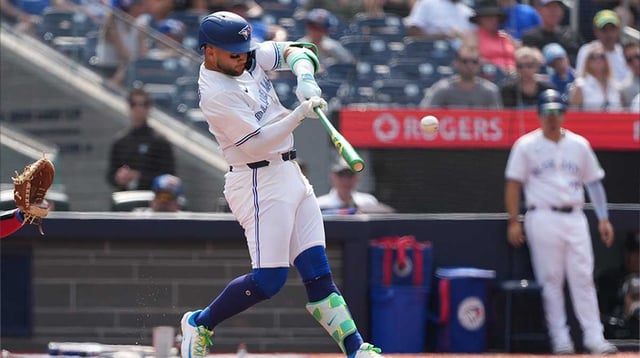 Aug 16, 2025; Toronto, Ontario, CAN; Toronto Blue Jays shortstop Bo Bichette (11) hits a single against the Texas Rangers during the the second inning at Rogers Centre. Credit: Nick Turchiaro-Imagn Images