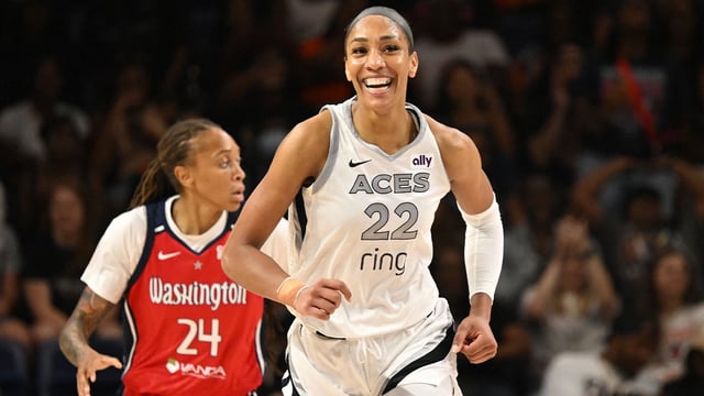 Aug 23, 2025; Washington, District of Columbia, USA; Las Vegas Aces center A'ja Wilson (22) is all smiles after a basket against the Washington Mystics during the fourth quarter at CareFirst Arena. Mandatory Credit: Rafael Suanes-Imagn Images