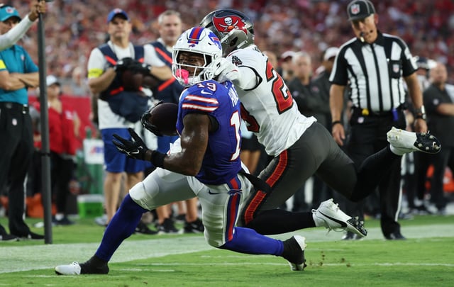 Aug 23, 2025; Tampa, Florida, USA; Tampa Bay Buccaneers safety Shilo Sanders (28) stops Buffalo Bills wide receiver KJ Hamler (19) at the one yard line during the first quarter at Raymond James Stadium. Mandatory Credit: Kim Klement Neitzel-Imagn Images