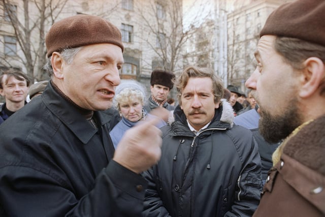 FILE - Two Ukrainians argue the merits of independence in Kyiv's central square, Dec. 2, 1991. (AP Photo/Liu Heung Shing, File)