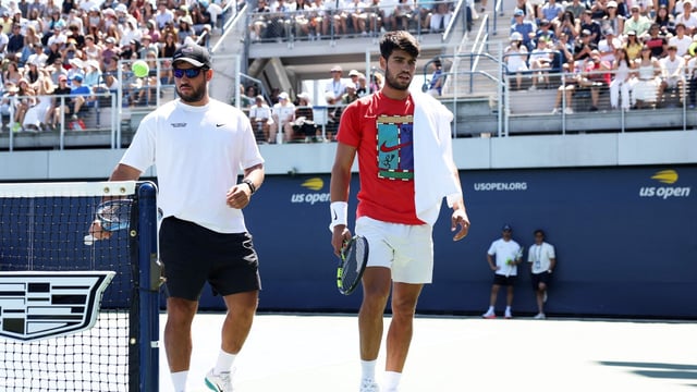 Carlos Alcaraz of Spain with his brother Alvaro Alcaraz as he walks to takes a break during a practice session ahead of the US Open