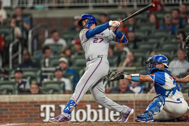 Aug 23, 2025; Cumberland, Georgia, USA; New York Mets third baseman Mark Vientos (27) hits a home run against the Atlanta Braves during the ninth inning at Truist Park. Mandatory Credit: Dale Zanine-Imagn Images