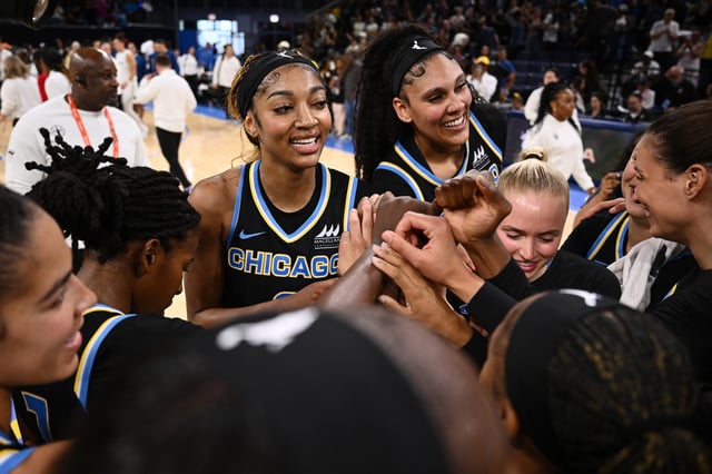Angel Reese #5 and Kamilla Cardoso #10 celebrate as the Chicago Sky huddle after the game against the Minnesota Lynx at Wintrust Arena on July 12, 2025 in Chicago, Illinois.