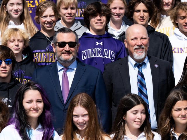 UNITED STATES - APRIL 27: Sen. Ted Cruz, R-Texas, and Rep. Chip Roy, R-Texas, pose with students from the Kincaid School on the House steps on Wednesday, April 27, 2022. (Bill Clark/CQ-Roll Call, Inc via Getty Images)