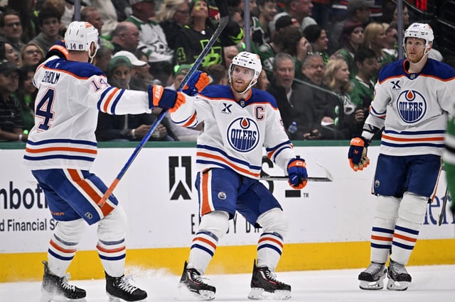 May 29, 2025; Dallas, Texas, USA; Edmonton Oilers center Connor McDavid (97) reacts after scoring a goal against the Dallas Stars during the second period in game five of the Western Conference Final of the 2025 Stanley Cup Playoffs at American Airlines Center. Mandatory Credit: Jerome Miron-Imagn Images