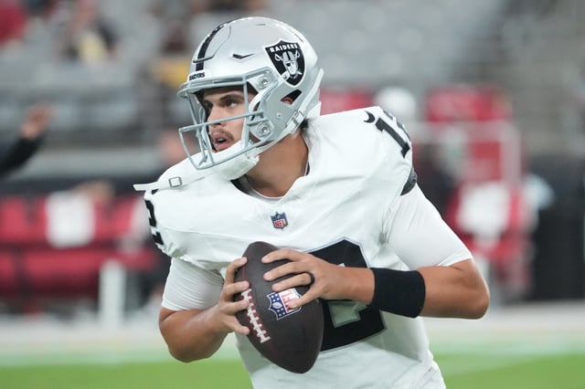 Aug 23, 2025; Glendale, Arizona, USA; Las Vegas Raiders quarterback Aidan O'Connell (12) warms up before the game against the Arizona Cardinals at State Farm Stadium. Mandatory Credit: Joe Camporeale-Imagn Images