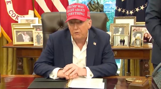 President Donald Trump covers his hand as he speaks from the Oval Office on Friday, Aug. 22.