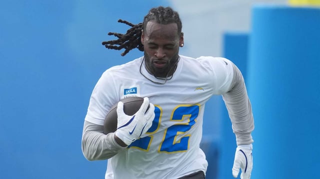 May 12, 2025; El Segundo, CA, USA; Los Angeles Chargers running back Najee Harris (22) carries the ball during offseason workouts at The Bolt. Mandatory Credit: Kirby Lee-Imagn Images