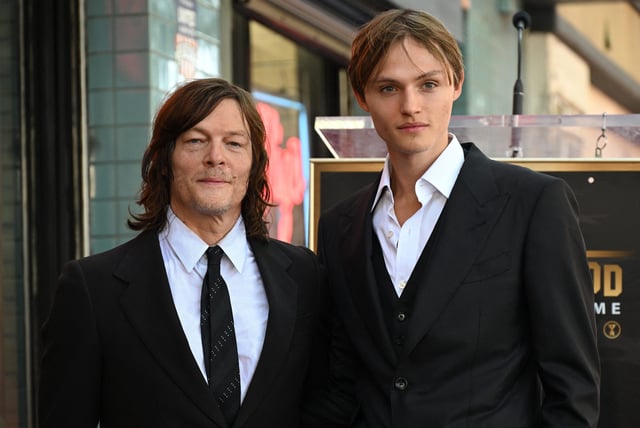 Norman Reedus, left, poses with his son Mingus Reedus during his Hollywood Walk of Fame ceremony on Sept. 27, 2022.
