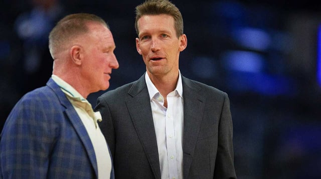Oct 18, 2023; San Francisco, California, USA; Golden State Warriors General Manager Mike Dunleavy (right) chats with Warriors great Chris Mullin before taking on the Sacramento Kings at Chase Center. Mandatory Credit: D. Ross Cameron-Imagn Images
