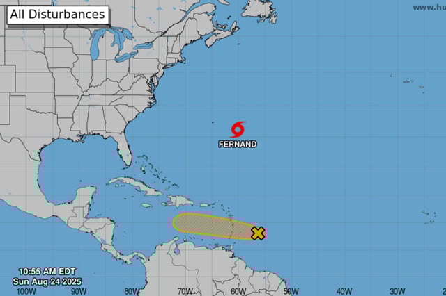 An NHC graphic highlights features being monitored in the Atlantic, with the disturbance in question marked in orange.