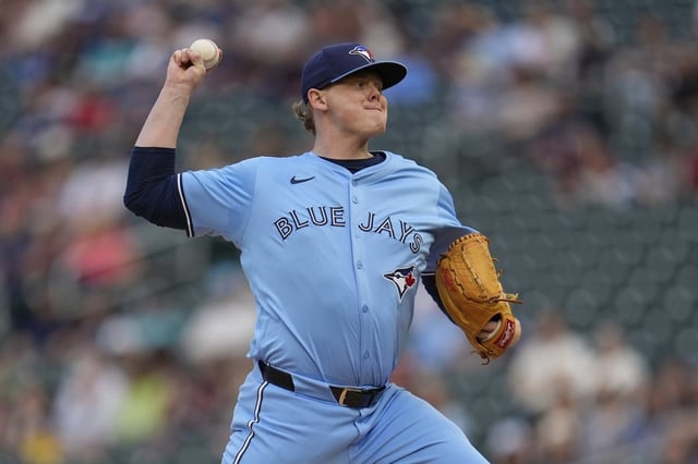 Toronto Blue Jays starting pitcher Paxton Schultz (65) delivers during the first inning of a baseball game against the Minnesota Twins, Friday, June 6, 2025, in Minneapolis. (AP Photo/Abbie Parr)