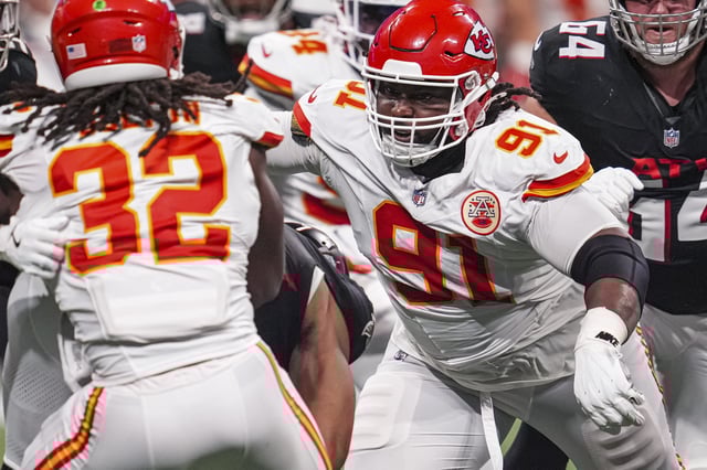 Sep 22, 2024; Atlanta, Georgia, USA; Kansas City Chiefs defensive tackle Derrick Nnadi (91) looks to tackle Atlanta Falcons running back Bijan Robinson (7) during the second half at Mercedes-Benz Stadium. Mandatory Credit: Dale Zanine-Imagn Images/File photo