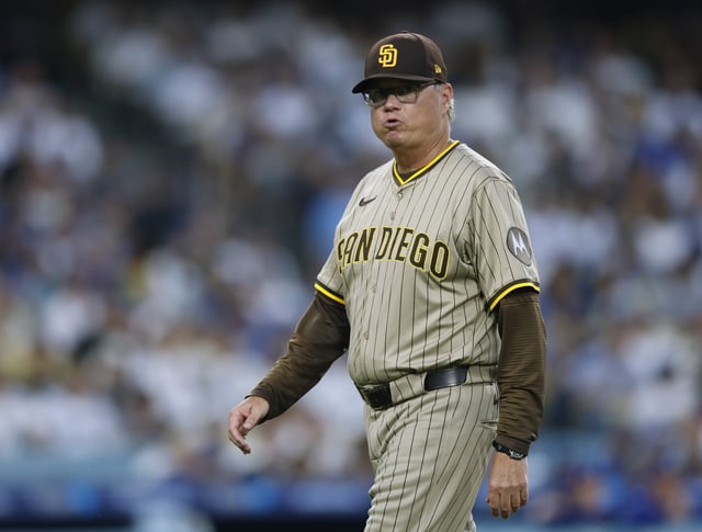 LOS ANGELES, CALIFORNIA - AUGUST 15: Mike Shildt #8 of the San Diego Padres reacts as he heads back to the dugout after removing Wandy Peralta #58 from the mound in the second inning during the game between the San Diego Padres and the Los Angeles Dodgers at Dodger Stadium on August 15, 2025 in Los Angeles, California.