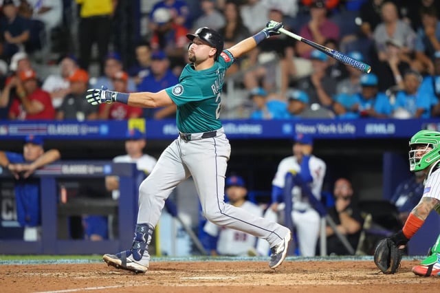 Aug 17, 2025; Williamsport, Pennsylvania, USA; Seattle Mariners catcher Cal Raleigh (29) hits a two-run home run against the New York Mets in the seventh inning at Journey Bank Ballpark at Historic Bowman Field. Mandatory Credit: Kyle Ross-Imagn Images/File photo