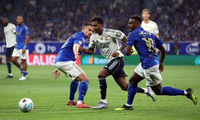 Soccer Football - LaLiga - Real Oviedo v Real Madrid - Estadio Carlos Tartiere, Oviedo, Spain - August 24, 2025 Real Madrid's Rodrygo in action with Real Oviedo's Haissem Hassan REUTERS/Pankra Nieto