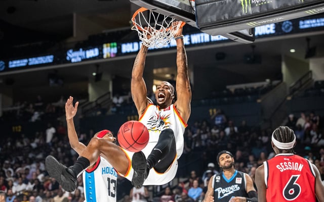 Former Orlando Magic star Dwight Howard slams the ball and roars at the crowd during the Big3 All Star basketball game in Orlando, Fla., Sunday, Aug. 24, 2025. (Willie J. Allen Jr./Orlando Sentinel)