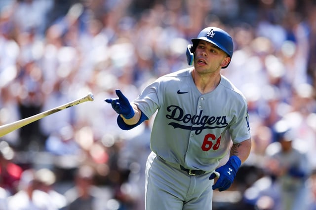The Dodgers’ Dalton Rushing tosses his bat after hitting a three-run home run against the San Diego Padres in the seventh inning Sunday, Aug. 24, 2025, in San Diego. (AP Photo/Derrick Tuskan)