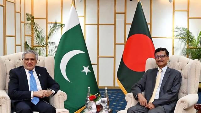 Foreign Affairs Advisor of Bangladesh's interim government Mohammad Touhid Hossain (R) posing alongside Pakistan's Foreign Minister Ishaq Dar during a bilateral meeting in Dhaka.