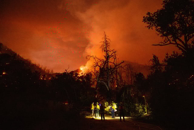 Napa Valley firefighters prepare to move out as the Pickett fire burns in Calistoga, California on August 21, 2025.