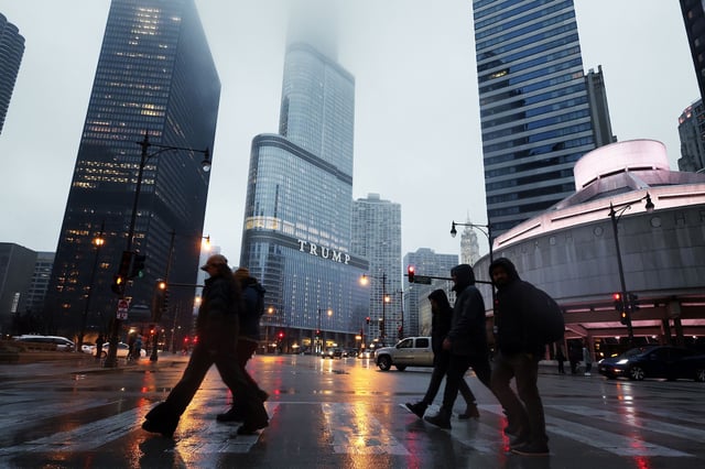 People walk past Trump International Hotel & Tower in Chicago on March 7.