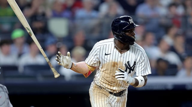 Jun 5, 2025; Bronx, New York, USA; New York Yankees third baseman Jazz Chisholm Jr. (13) watches his RBI single against the Cleveland Guardians during the seventh inning at Yankee Stadium. Mandatory Credit: Brad Penner-Imagn Images