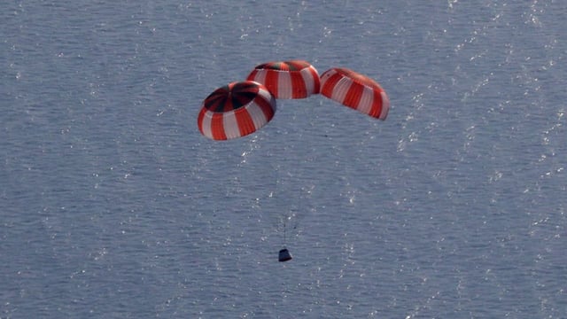 Gaganyaan crew module descending under parachute during the air drop test. (Photo: Isro)