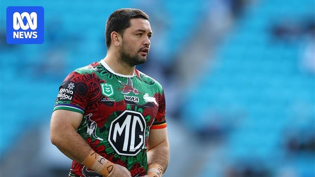 A portrait shot of a rugby league player in red and green