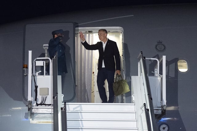 Prime Minister Mark Carney boards a government plane as he departs for Poland, Germany and Latvia from the airport in Ottawa on Saturday, Aug. 23, 2025. THE CANADIAN PRESS/Christinne Muschi