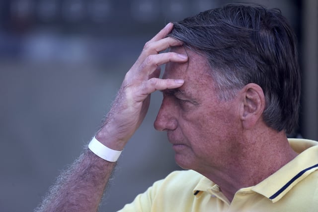 Brazil's former President Jair Bolsonaro leaves a hospital after undergoing medical examinations, authorised by Supreme Court Justice Alexandre de Moraes, to return to house arrest as he awaits trial after being accused of plotting a coup following his electoral defeat, in Brasilia, Brazil, August 16, 2025. REUTERS/Adriano Machado/File Photo