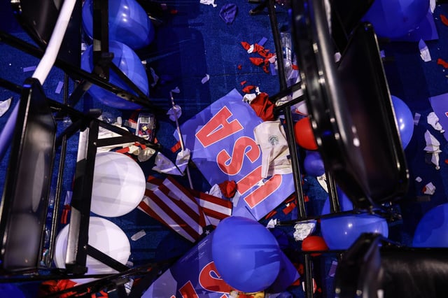 CHICAGO, ILLINOIS - AUGUST 22: Balloons and signs lay on the floor as people celebrate during the final day of the Democratic National Convention at the United Center on August 22, 2024 in Chicago, Illinois. Delegates, politicians, and Democratic Party supporters are gathering in Chicago, as current Vice President Kamala Harris is named her party's presidential nominee. The DNC takes place from August 19-22.