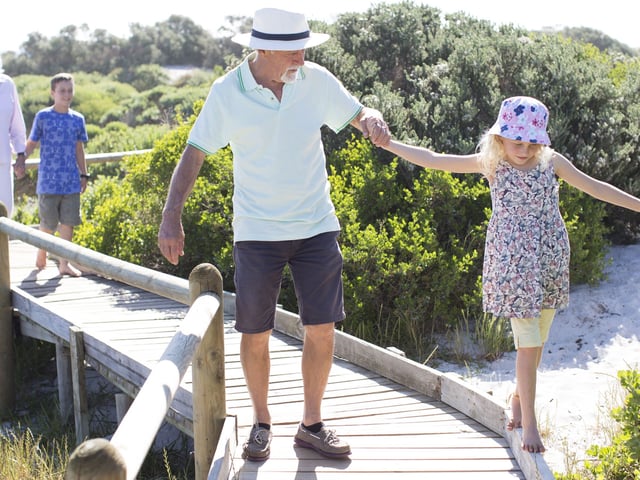 Grandparents on a nature walk with their grandchildren. 