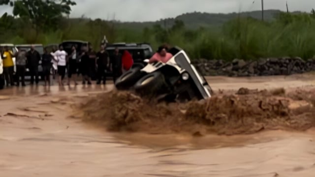 A vehicle overturned in raging waters at an offroad track.