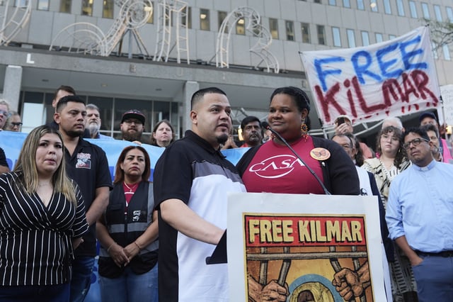 Jennifer Vasquez Sura, front left, wife of Kilmar Abrego Garcia, attends a protest rally at the Immigration and Customs Enforcement field office in Baltimore, Monday, Aug. 25, 2025, to support Kilmar Abrego Garciab. (AP Photo/Stephanie Scarbrough)