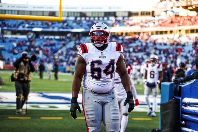 ORCHARD PARK, NEW YORK - DECEMBER 22: Layden Robinson #64 of the New England Patriots looks on prior to a game against the Buffalo Bills at Highmark Stadium on December 22, 2024 in Orchard Park, New York.