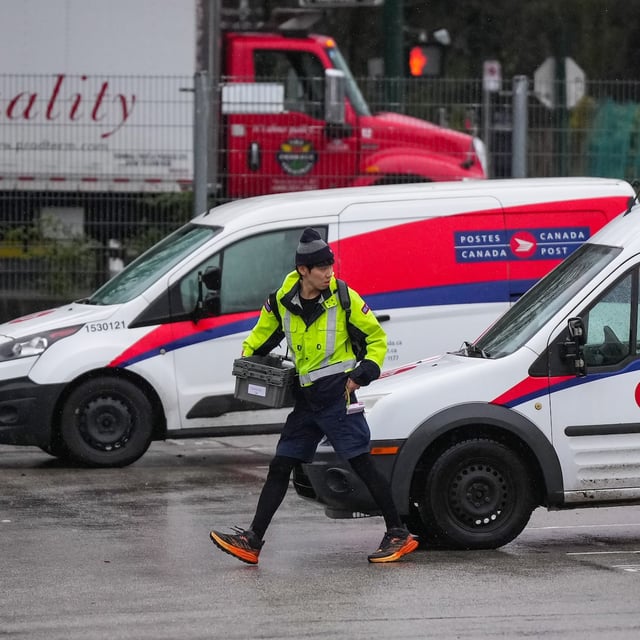 A Canada Post employee returns to a delivery depot in Vancouver, B.C., on Tuesday, Dec. 17, 2024. THE CANADIAN PRESS/Darryl Dyck