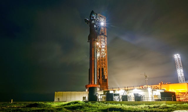 A SpaceX Starship spacecraft sits atop a super heavy booster at the launch pad Aug. 25 before its scheduled tenth test flight, at the company's complex in Starbase, Texas. SpaceX scrubbed the launch and is now targeting an Aug. 25 launch window.