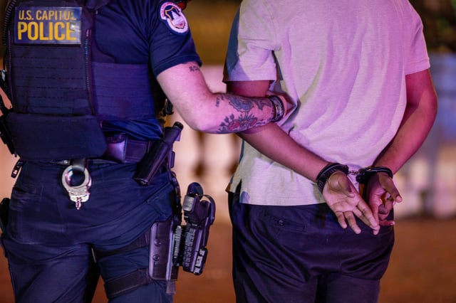A man is arrested in Washington, D.C., on Aug. 24, 2025.